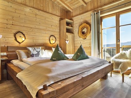 gemütliches Schlafzimmer im Chalet auf dem Bauernhof